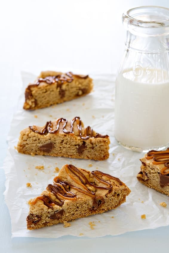 Snickers Chocolate Chip Cookie Bars  bake up in 30 minutes! Drizzle them with caramel and chocolate to make them even more irresistible.