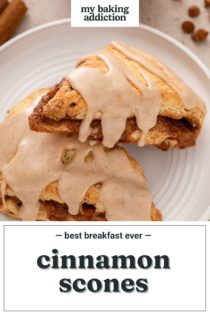 One cinnamon scone leaning against a second on a white plate. Text overlay includes recipe name.