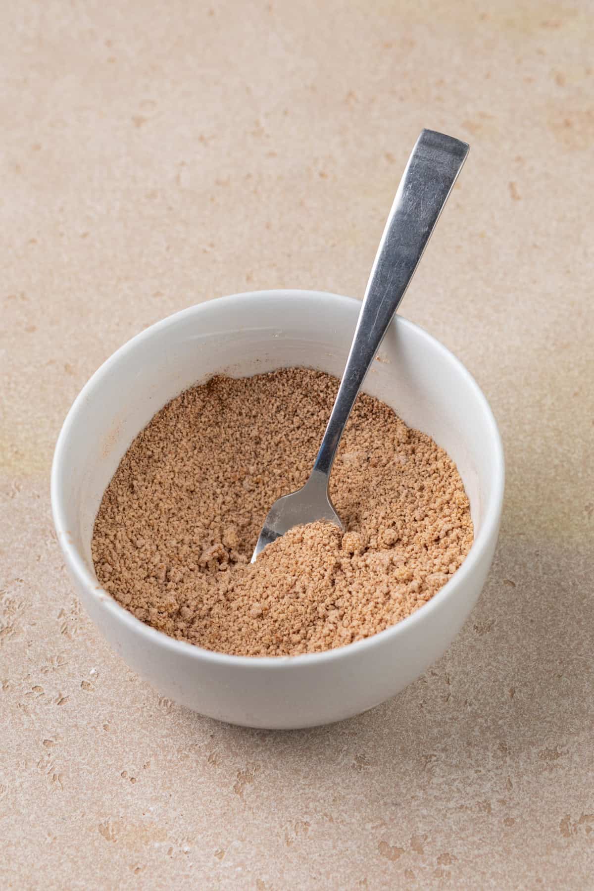 Cinnamon-sugar scone filling mixed in a white bowl.