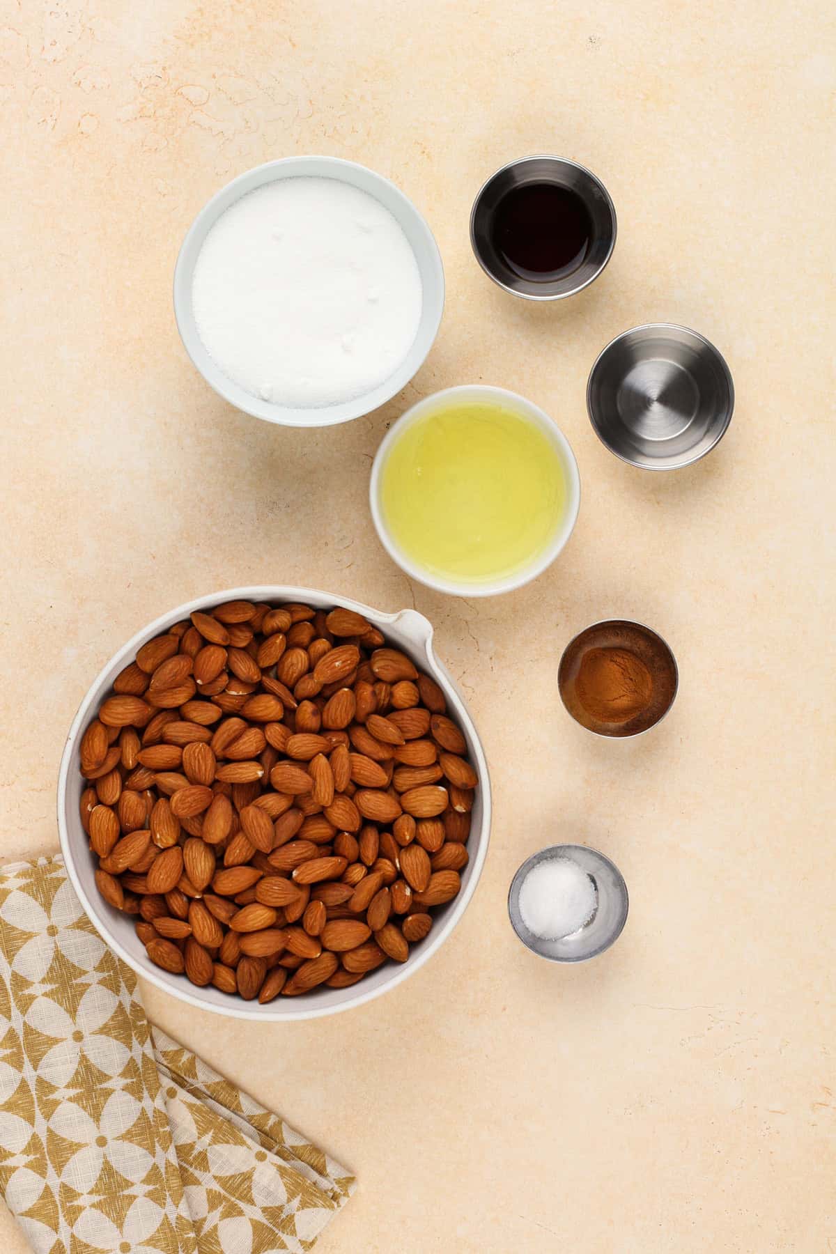 Ingredients for candied almonds arranged on a countertop.