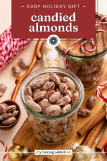 Candied almonds in glass jars with gift tags for the holidays. Text overlay includes recipe name.