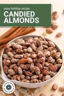 White bowl filled with candied almonds on a countertop. Text overlay includes recipe name.