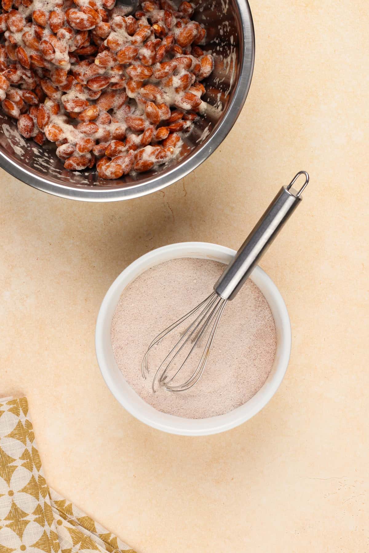 Cinnamon sugar mixture for candied almonds in a small bowl.