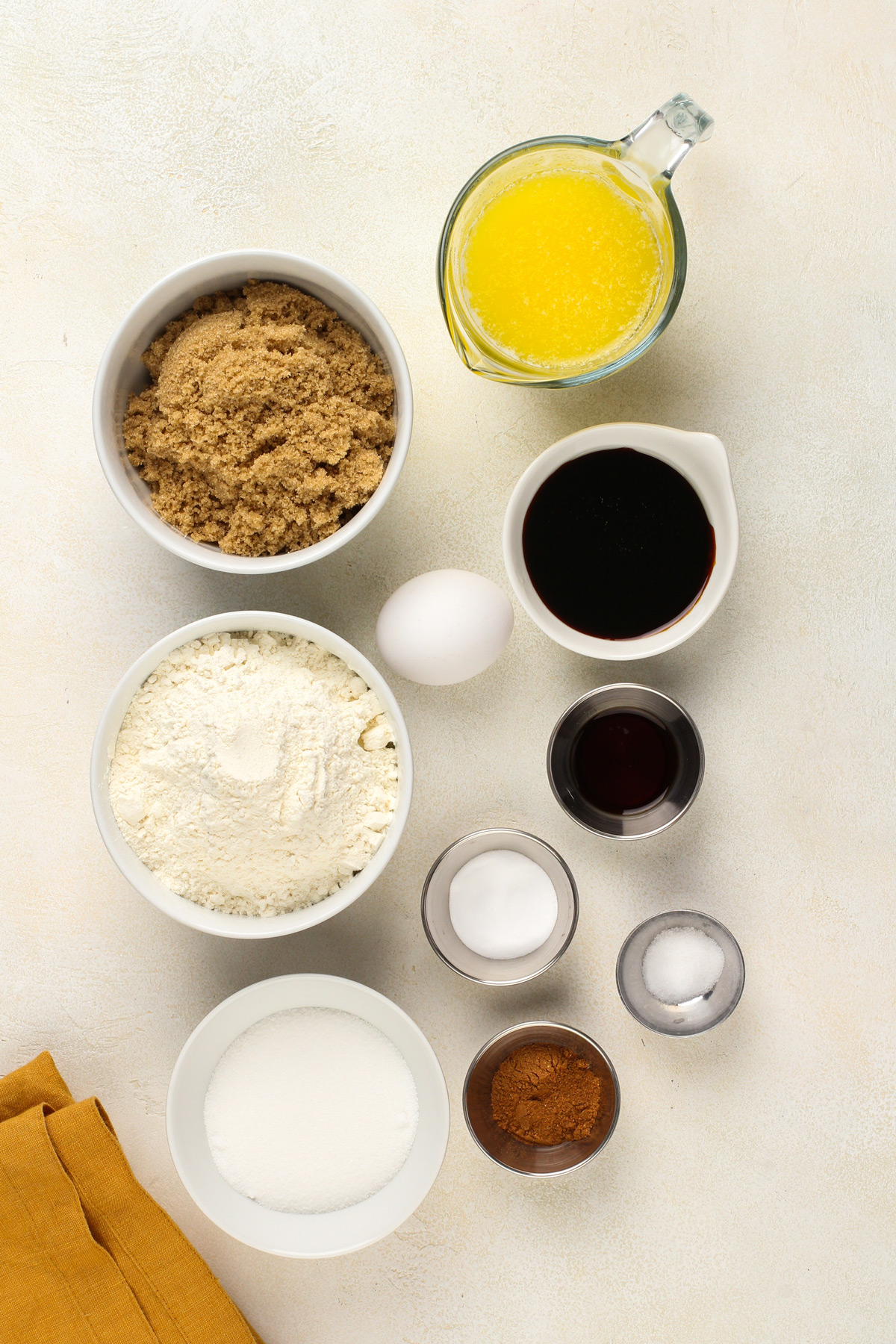 Molasses cookie ingredients arranged on a countertop.