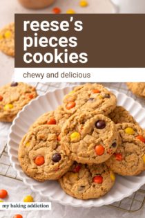 White platter filled with reese's pieces cookies. Text overlay includes recipe name.