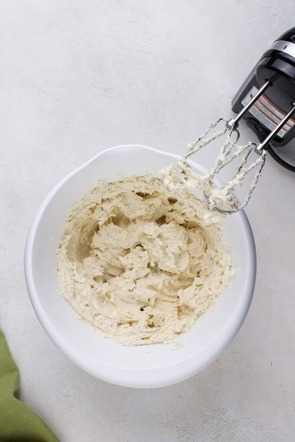 Cream cheese softened with an electric mixer.