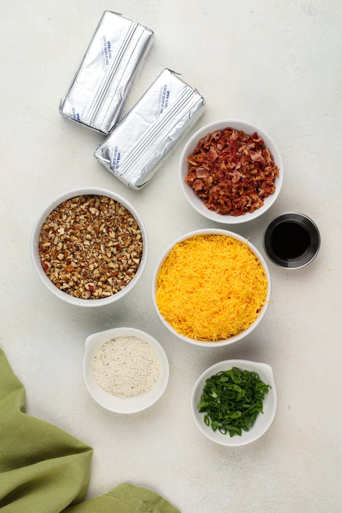 Ingredients for mini cheese balls arranged on a countertop.