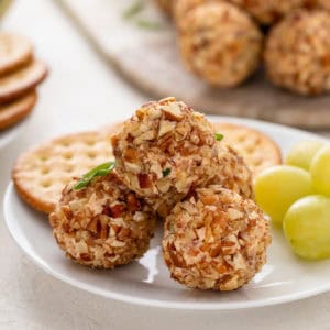 Mini cheese balls on a white plate.