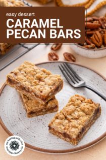 Three caramel pecan bars next to a fork on a plate. Text overlay includes recipe name.