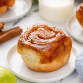 Plated caramel apple cinnamon roll.