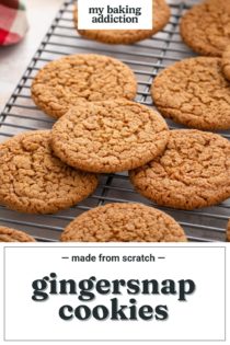 Close up of gingersnap cookies cooling on a wire rack. Text overlay includes recipe name.