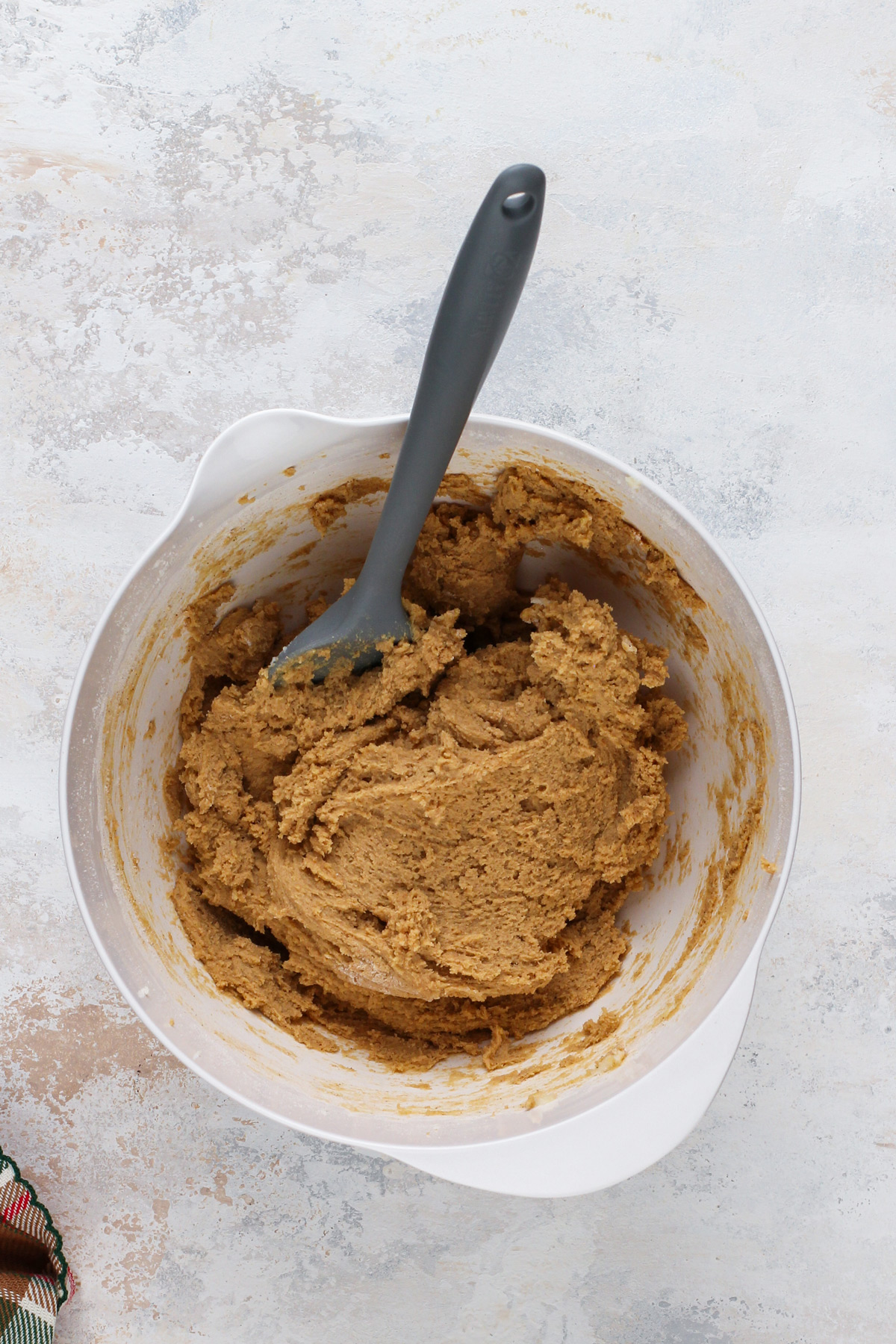 Gingersnap cookie dough in a white bowl.