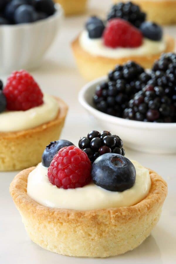 Berry Cookie Cups are loaded with sweet, summer flavor. The sugar cookie crust makes them irresistible. Recipe contains a gluten-free option. 