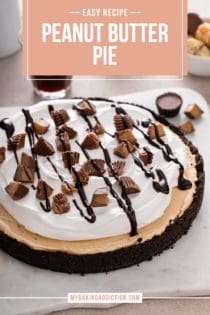 Peanut butter pie set on a slice of parchment paper and topped with chocolate sauce and chopped peanut butter cups. Text overlay includes recipe name.