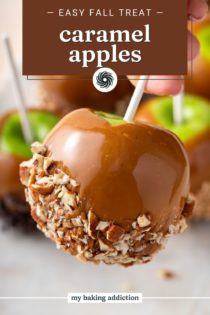 Hand holding up a caramel apple dipped in chopped pecans. Text overlay includes recipe name.