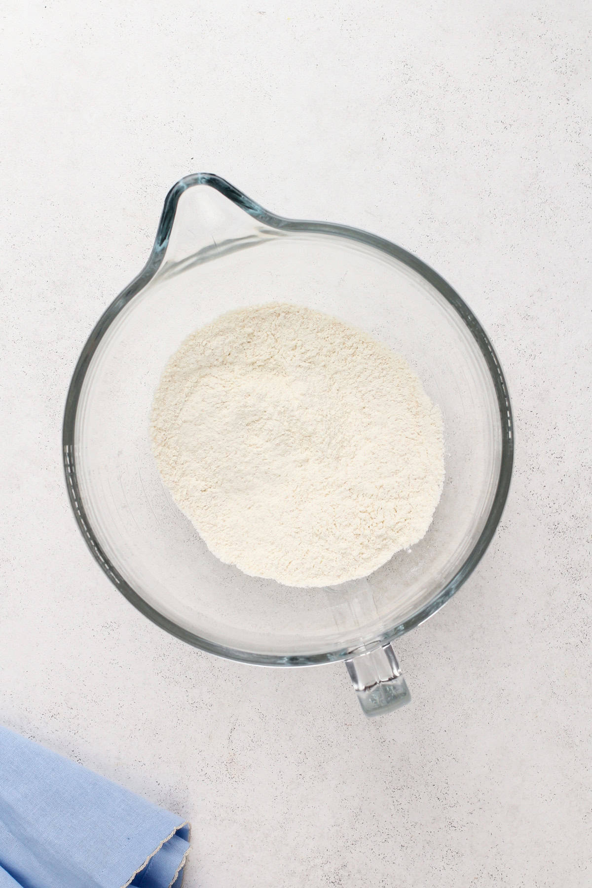 Dry ingredients for mini cinnamon rolls in a bowl.