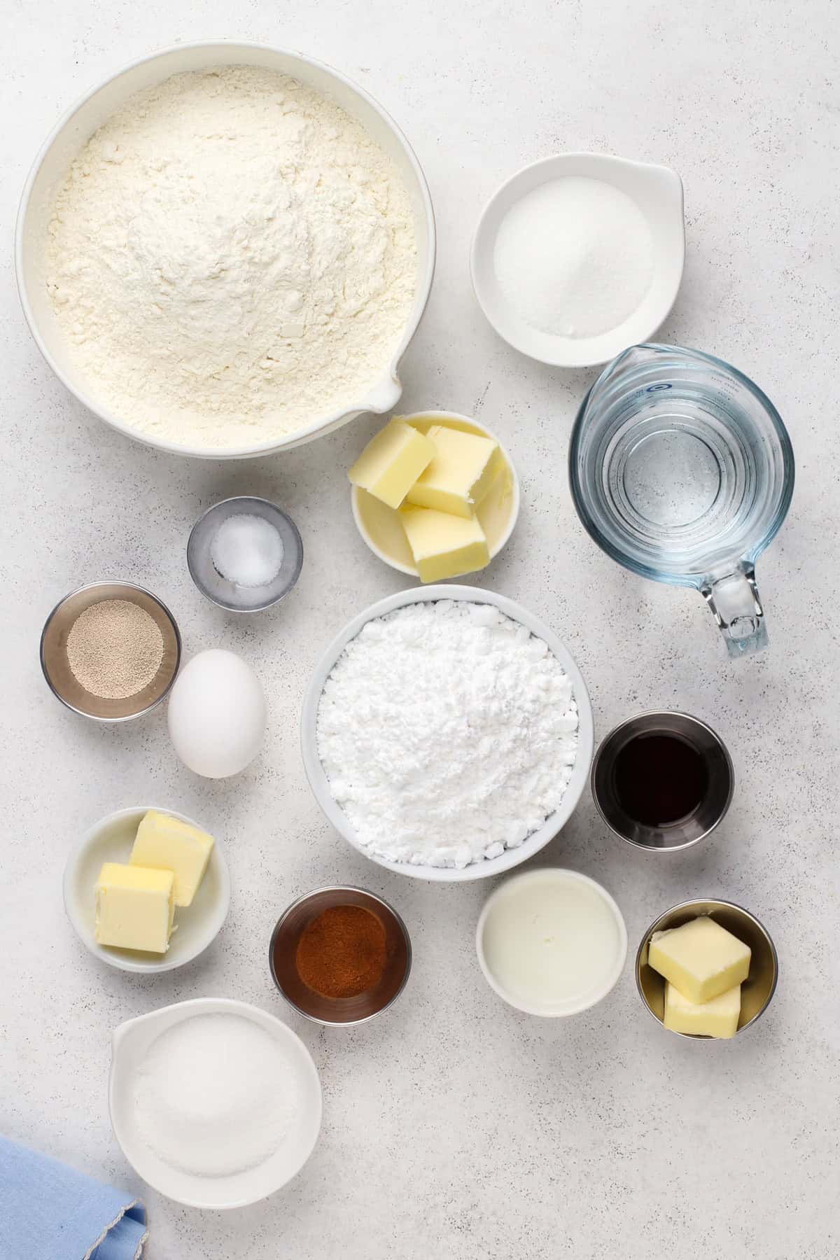 Mini cinnamon roll ingredients arranged on a countertop.