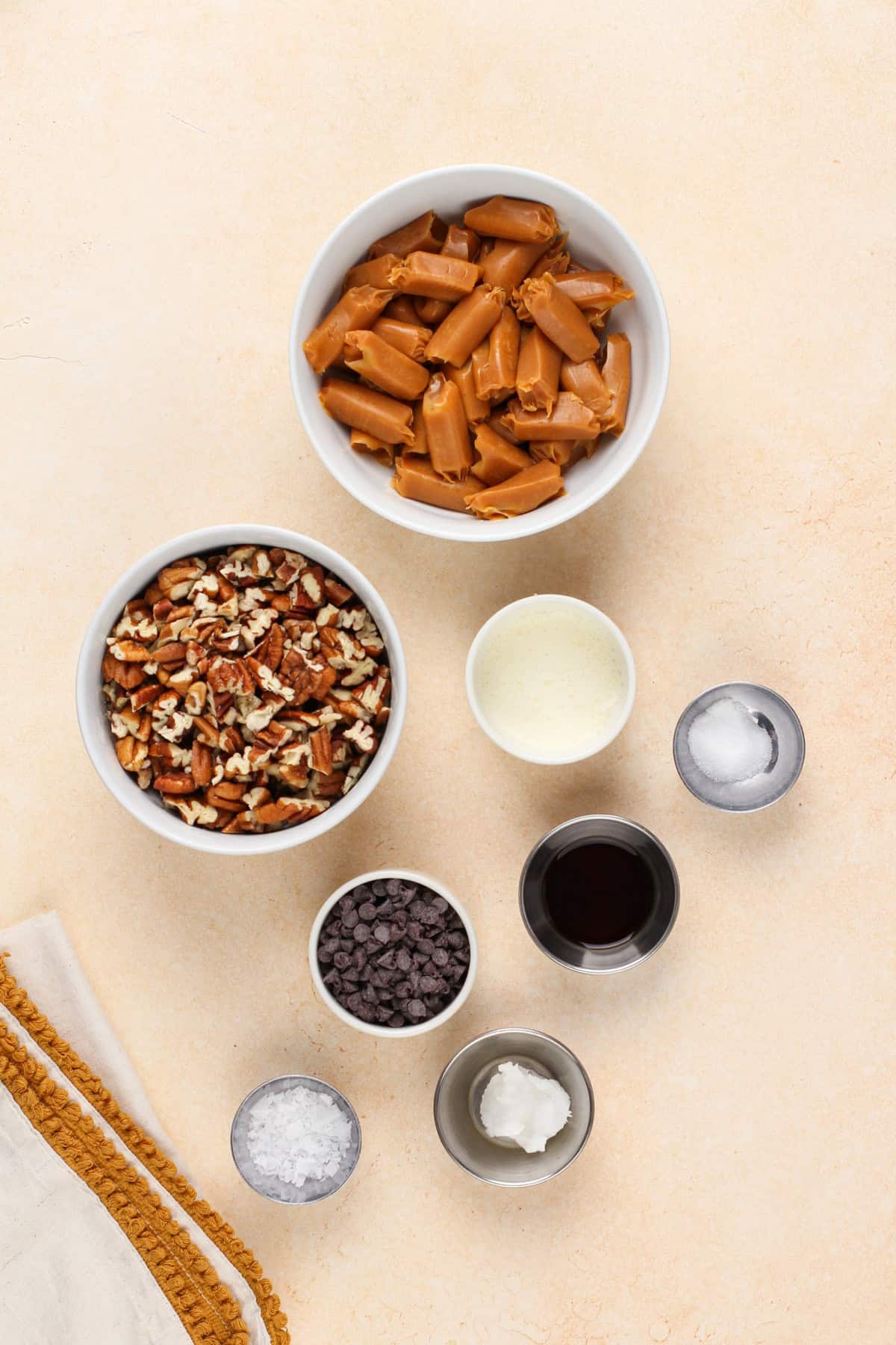 Pecan caramel cluster ingredients on a countertop.