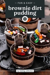 Several decorated brownie dirt puddings arranged on a Halloween themed platter. Text overlay includes recipe name.