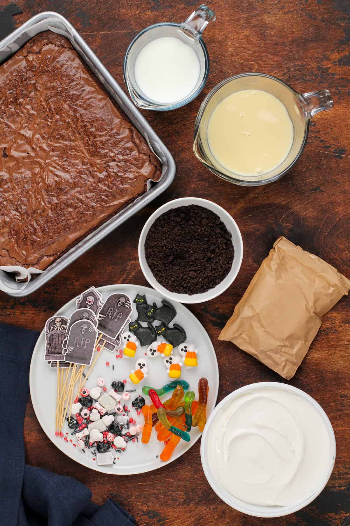 Brownie dirt pudding ingredients arranged on a countertop.