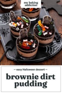 Four individual brownie dirt puddings, decorated with Halloween candies, arranged on a black platter. Text overlay includes recipe name.