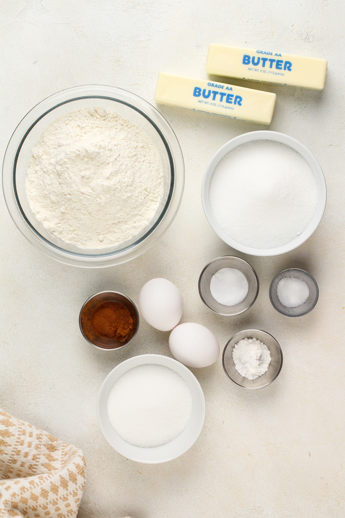 Ingredients for snickerdoodle cookies arranged on a countertop.