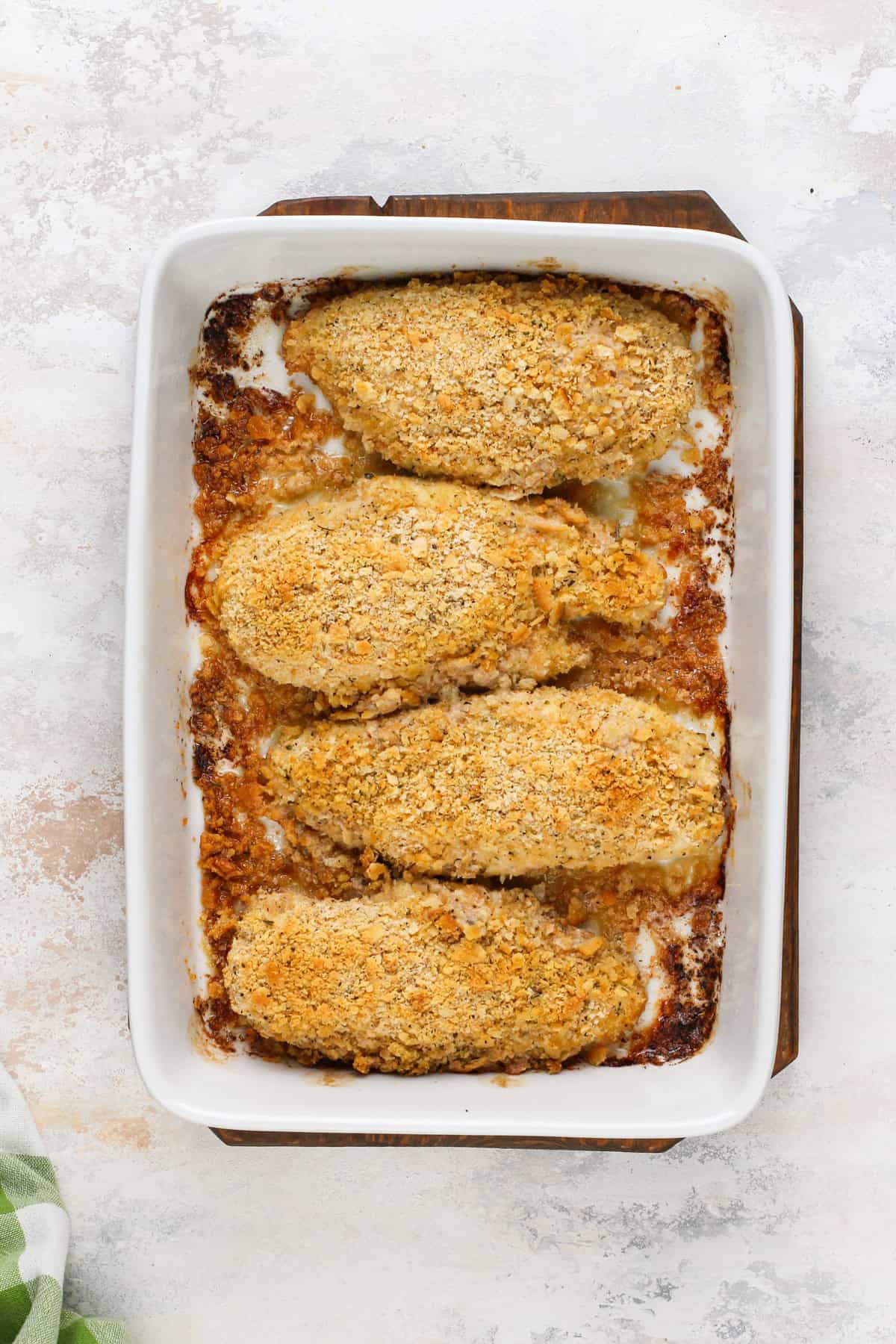 Overhead view of baked ritz cracker chicken in a white baking dish.