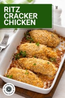 Baked ritz cracker chicken in a white baking dish set on a trivet. Text overlay includes recipe name.