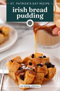 Whiskey caramel sauce being poured from a pitcher over a slice of irish bread pudding on a white plate. Text overlay includes recipe name.