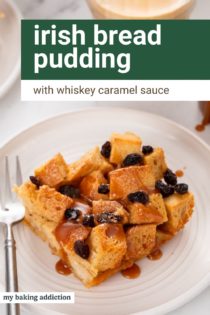 Slice of irish bread pudding topped with whiskey caramel sauce on a white plate. Text overlay includes recipe name.