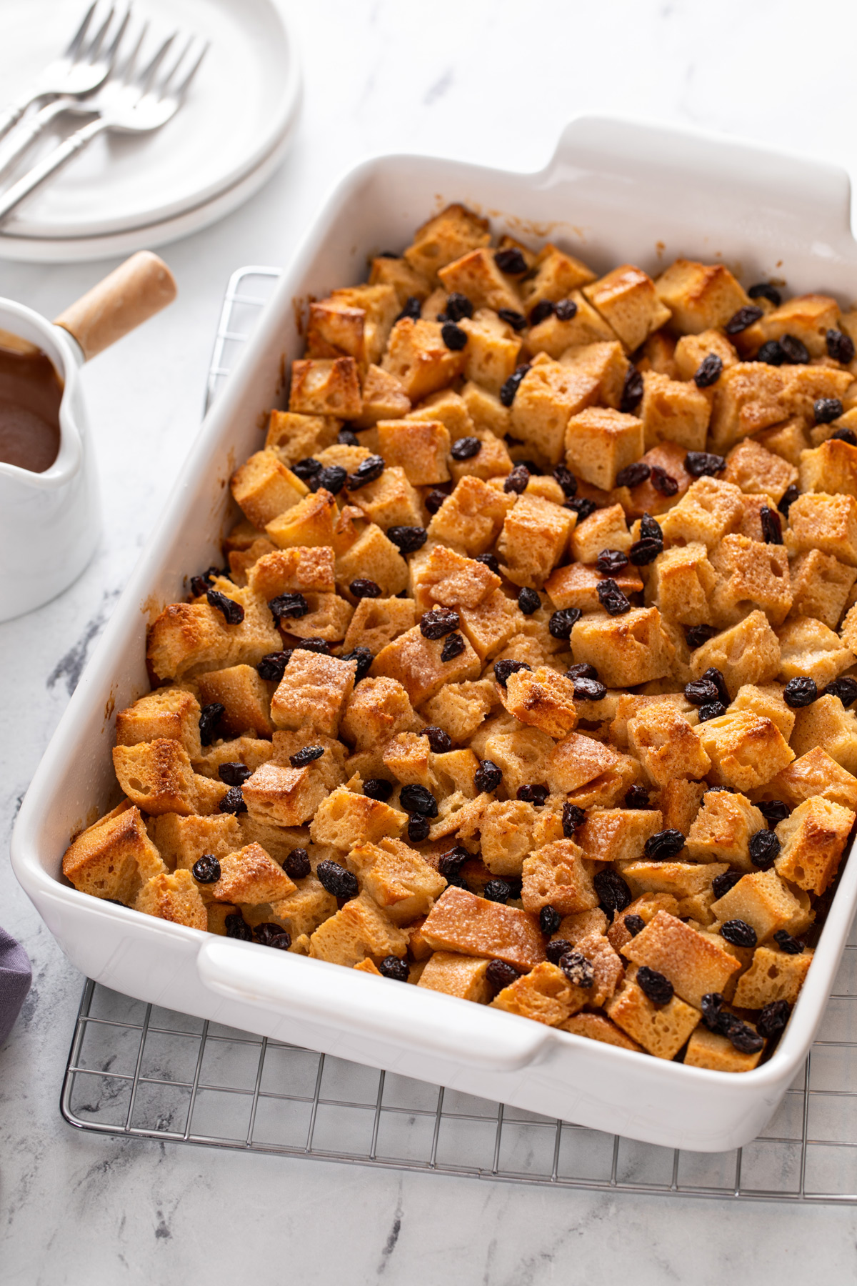 White baking dish filled with baked irish bread pudding.