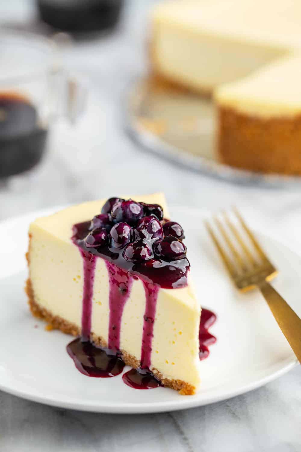https://www.mybakingaddiction.com/wp-content/uploads/2019/07/Cheesecake-with-Blueberry-Sauce-61-of-61-1_resized.jpg