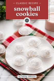 White plate filled with snowball cookies on a plaid napkin. Text overlay includes recipe name.