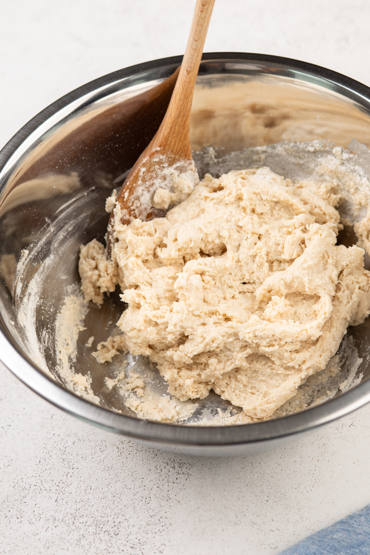 Bisquick biscuit dough in a metal bowl.