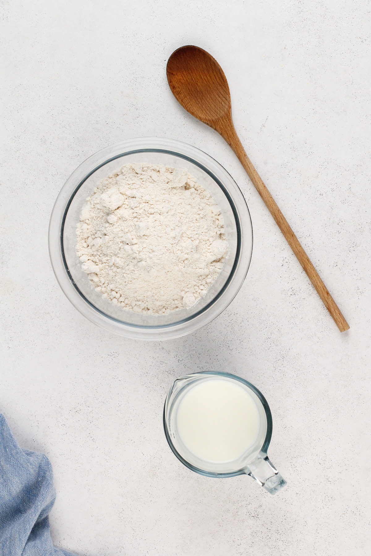 Ingredients for bisquick biscuits arranged on a countertop.