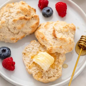 Buttered bisquick biscuit on a plate.