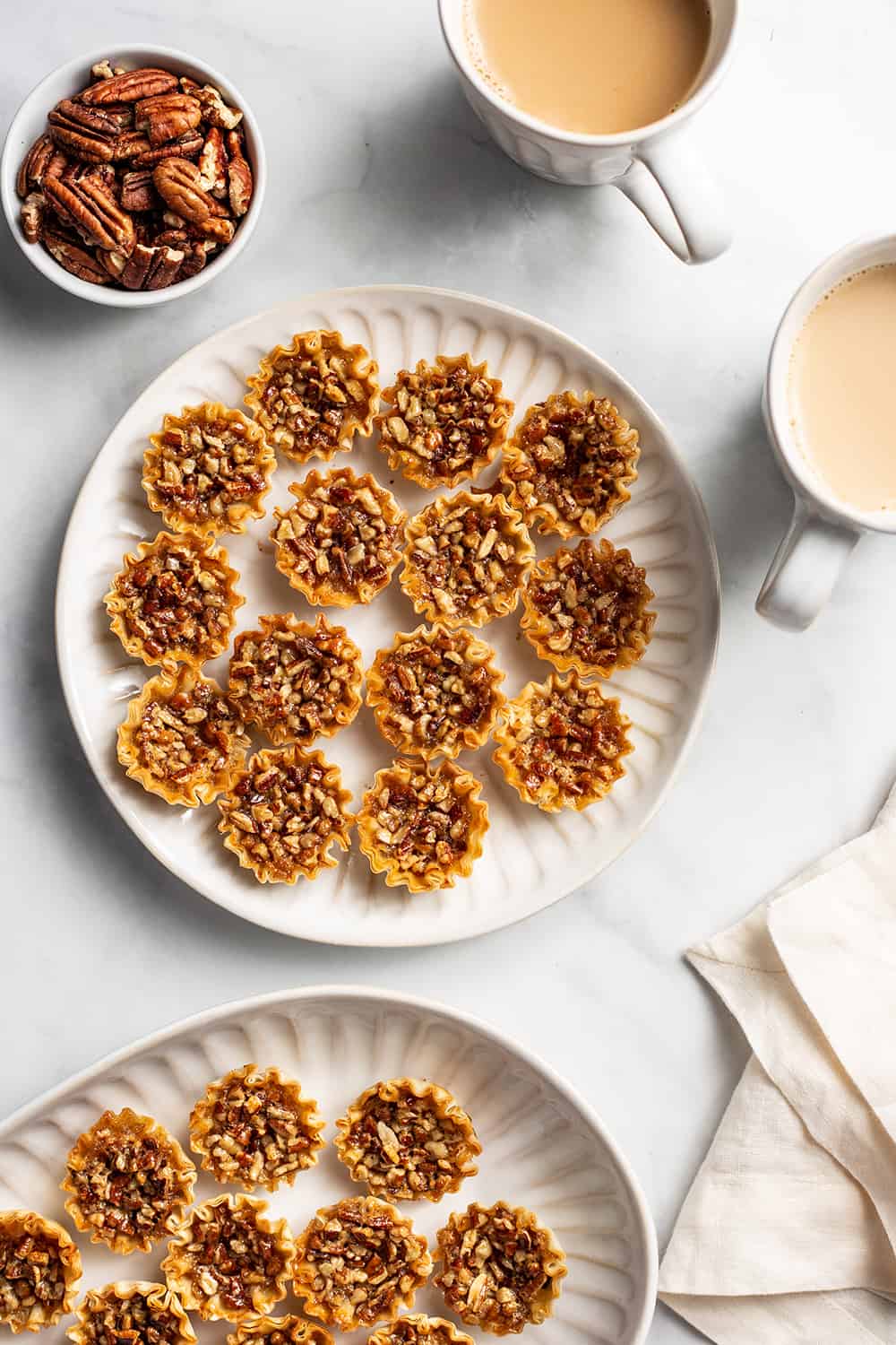 Phyllo pastry cups filled with traditional pecan pie. Take pecan