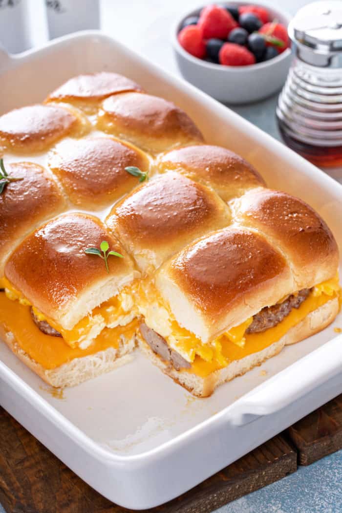 Pan of breakfast sliders with the corner slider taken out.