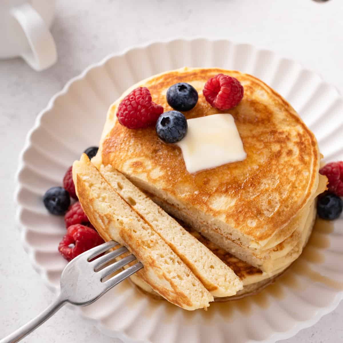 https://www.mybakingaddiction.com/wp-content/uploads/2023/05/fork-of-buttermilk-pancakes-hero.jpg