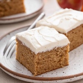 Two slices of apple butter cake on a stoneware plate.