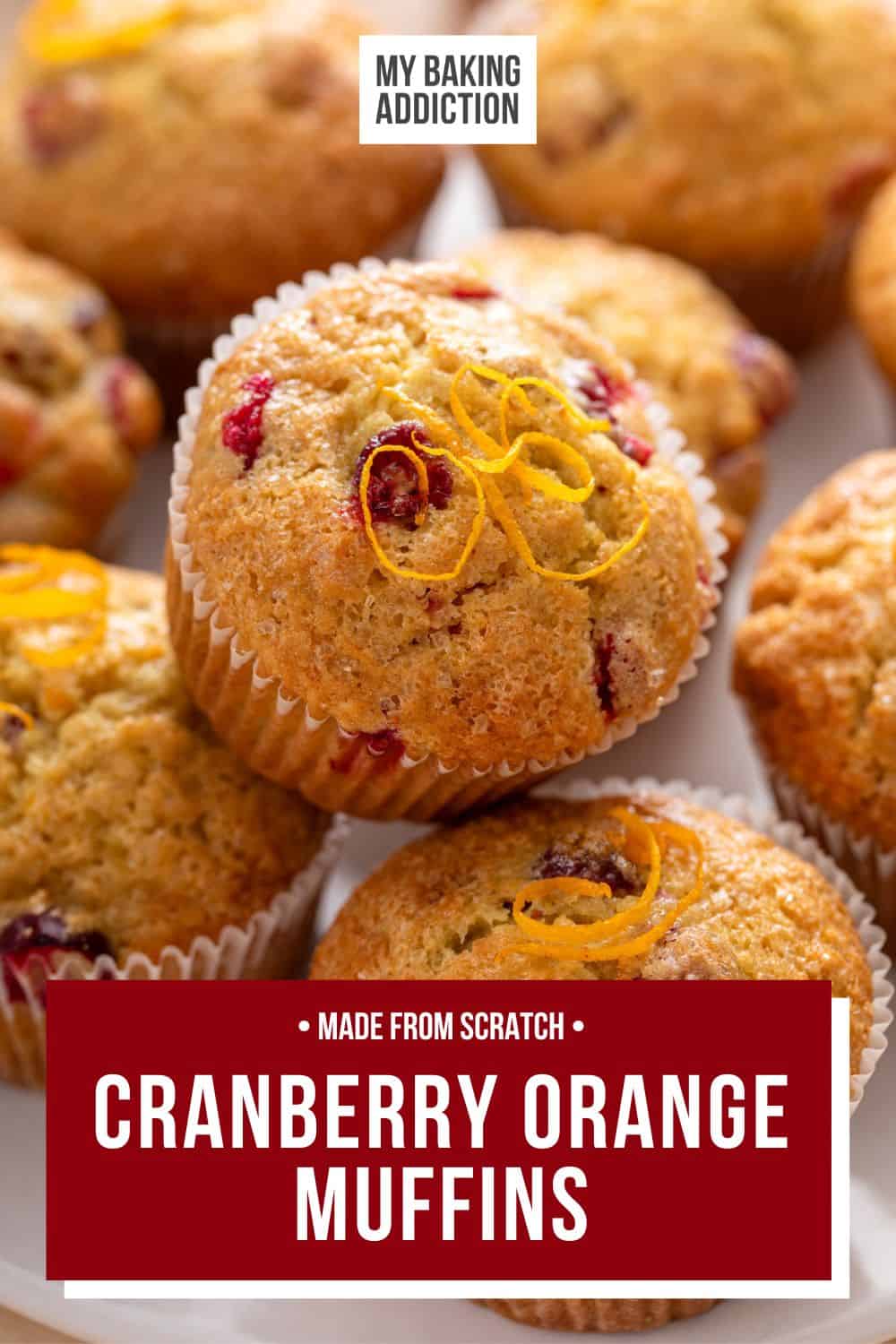 Close up of cranberry muffins arranged on a white plate.  The text overlay includes the recipe name.