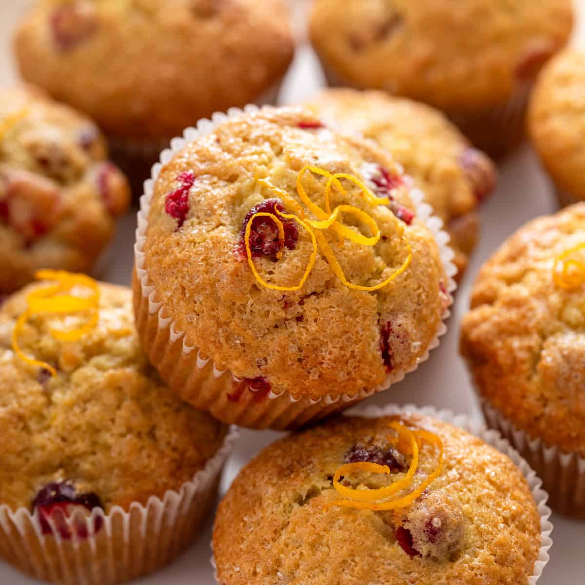 https://www.mybakingaddiction.com/wp-content/uploads/2023/12/platter-of-cranberry-orange-muffins-hero.jpg