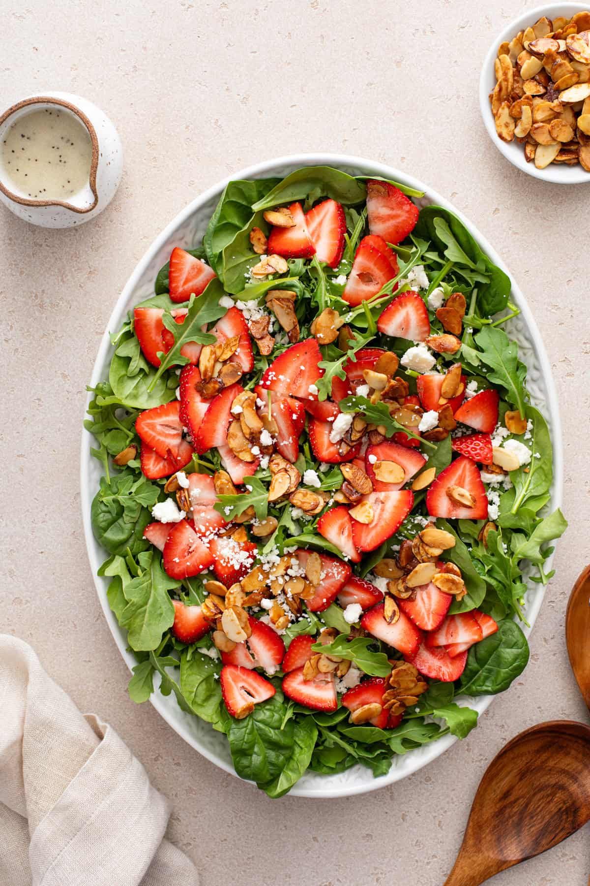 Overhead view of a serving platter filled with strawberry salad.