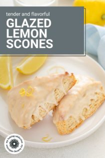 Two lemon scones next to lemon wedges on a white plate. Text overlay includes recipe name.