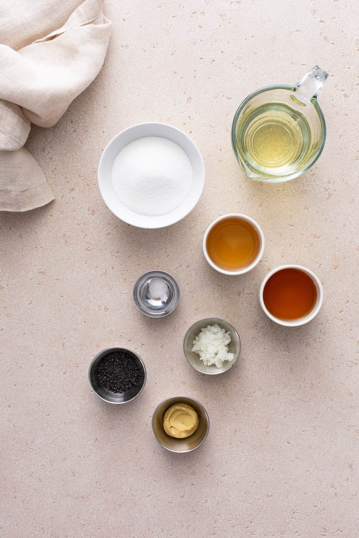poppy seed dressing ingredients arranged on a countertop.