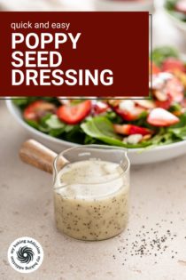 Jar of poppy seed dressing in front of a large bowl of strawberry spinach salad. Text overlay includes recipe name.