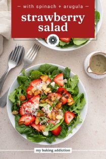 Overhead view of two bowls of strawberry salad topped with poppy seed dressing. Text overlay includes recipe name.