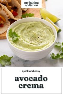 Bowl of avocado crema on a marble countertop in front of a platter of tacos. Text overlay includes recipe name.