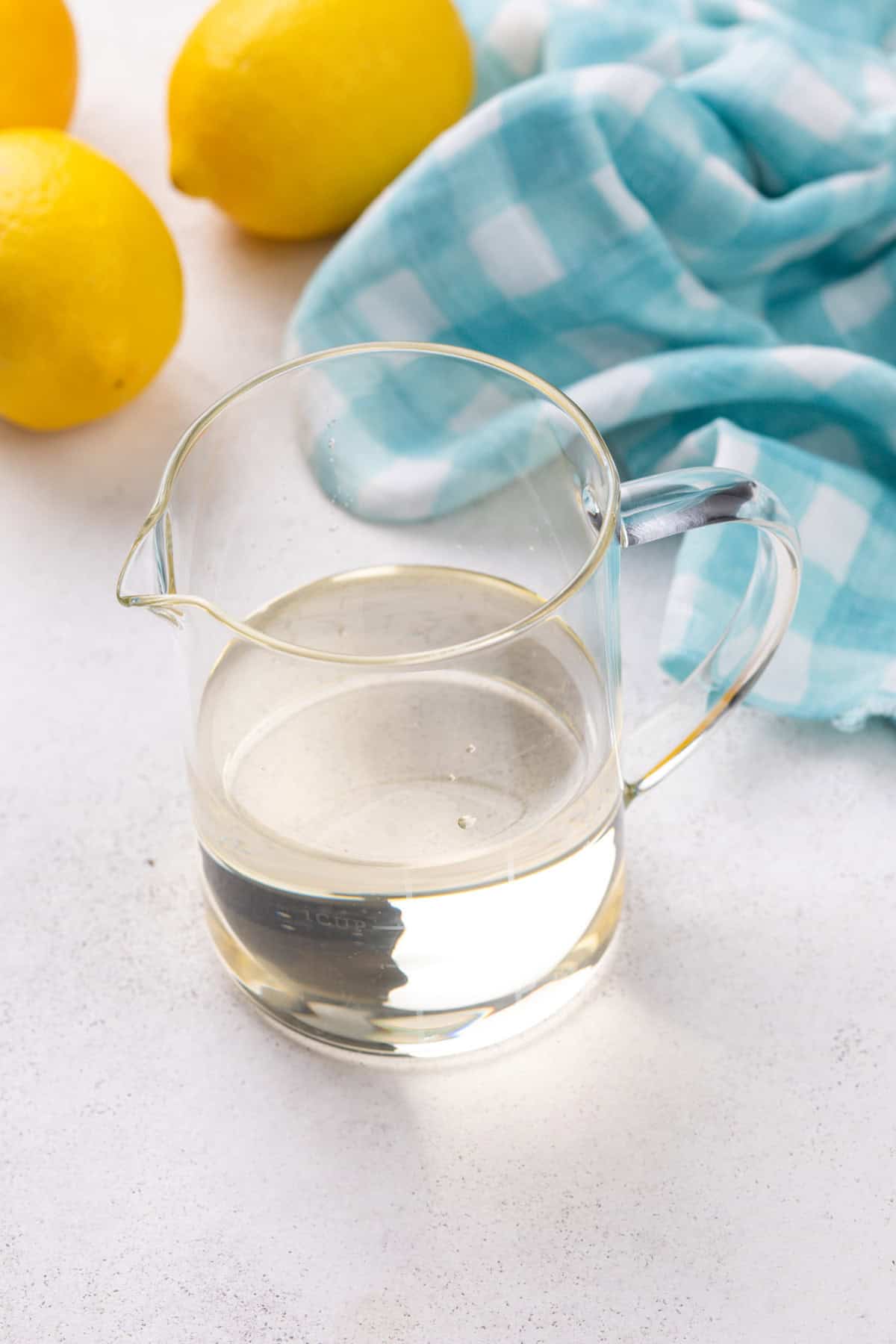 Simple syrup in a small glass pitcher.