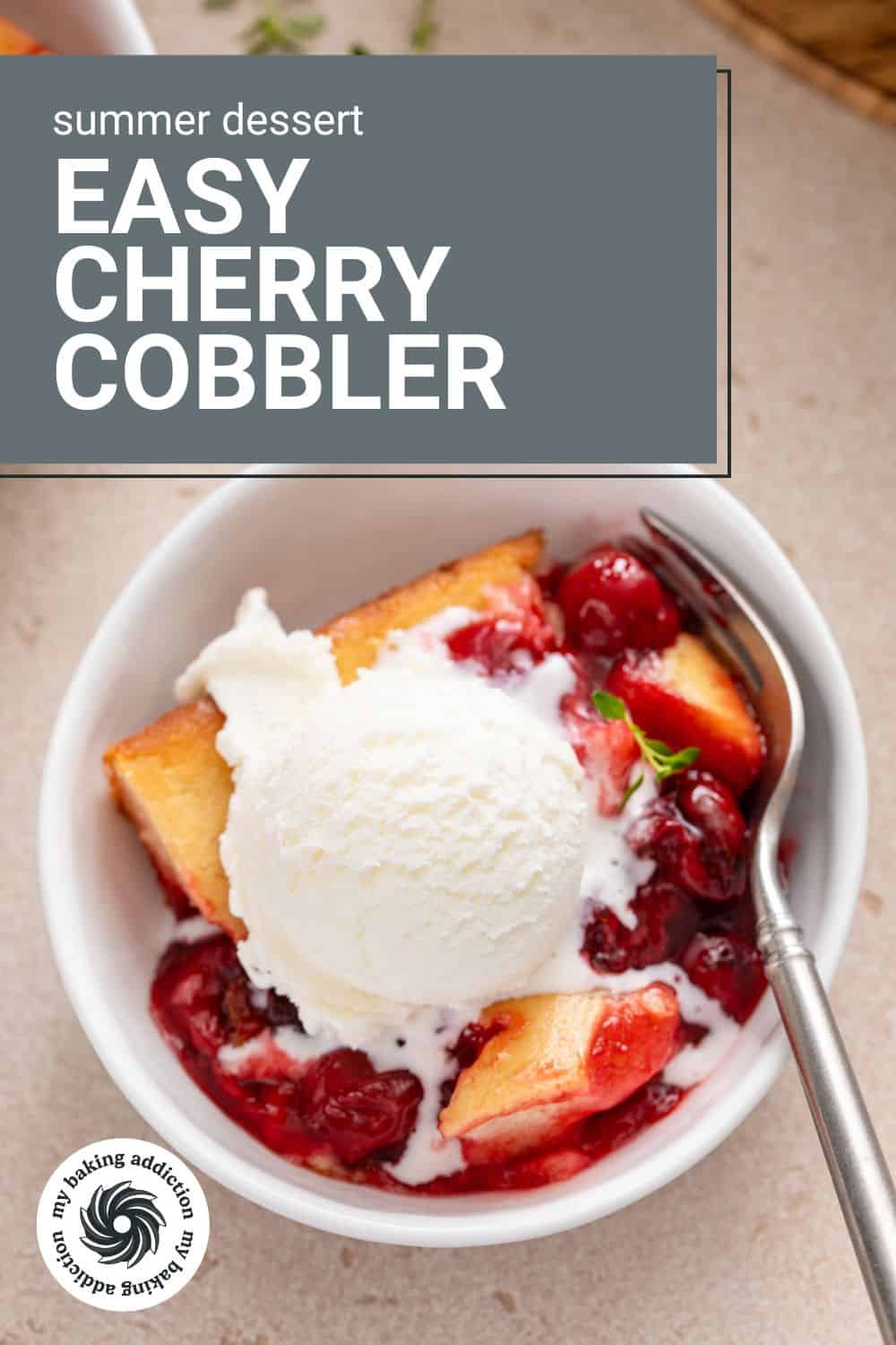 Overhead close up of a white bowl filled with a serving of easy cherry cobbler topped with ice cream. Text overlay includes recipe name.